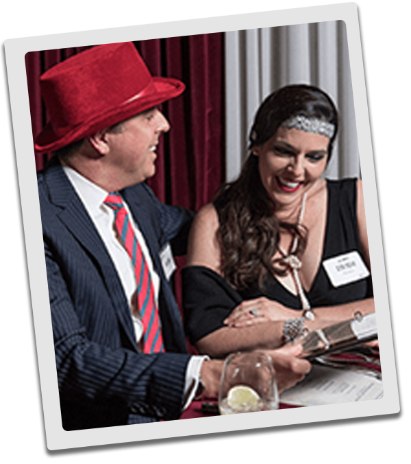 New York Murder Mystery couple checking out the dinner menu